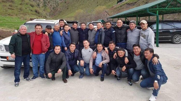 A group of men pose together for a photo dqeiqeuiteixqkmp
